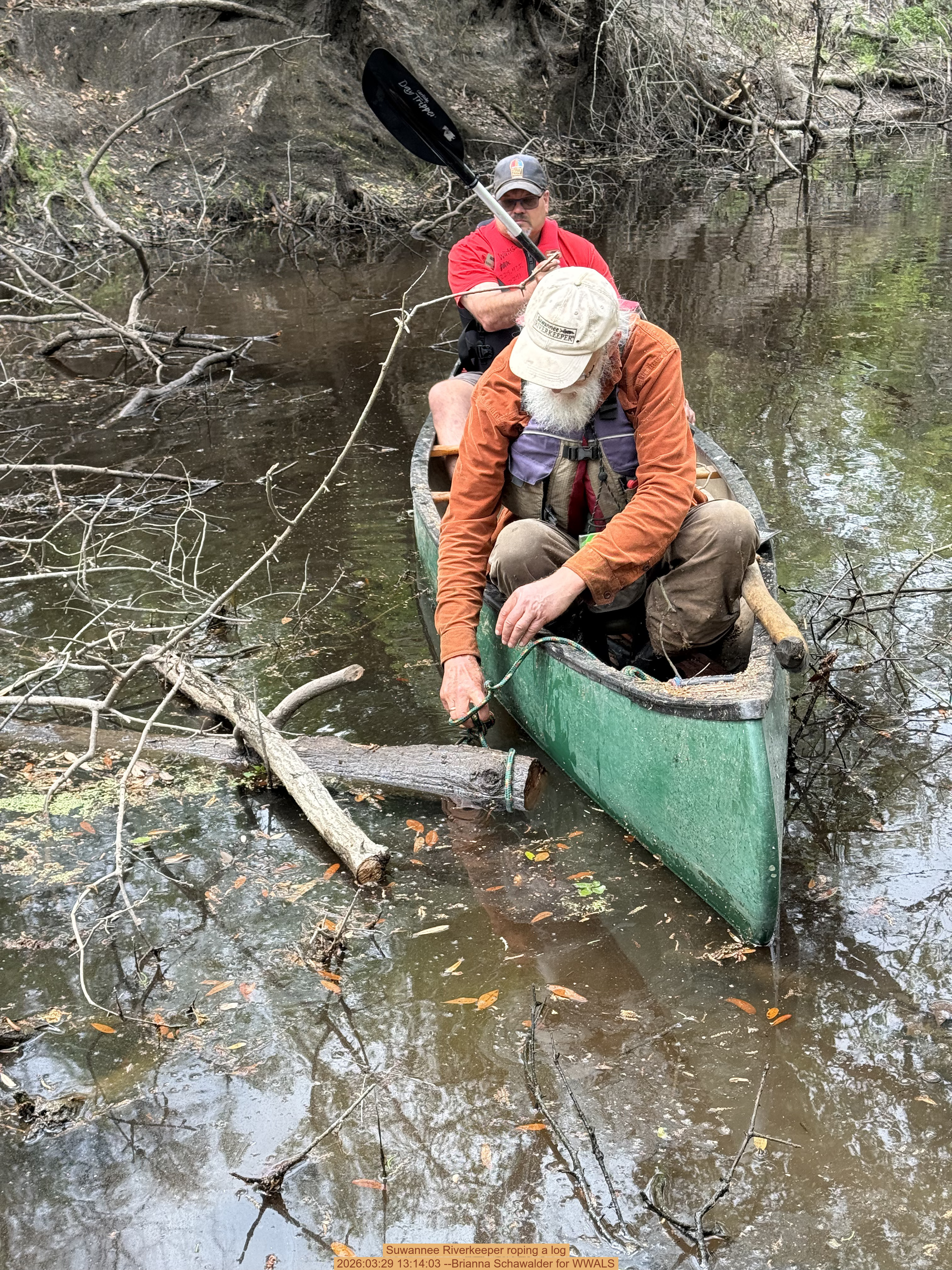 Suwannee Riverkeeper roping a log, 2026:03:29 13:14:03 --Brianna Schawalder for WWALS