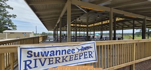 [Suwannee Riverkeeper banner on pavilion, 2026:06:20 12:26:21, 31.1620943, -83.5482366 --jsq for WWALS]