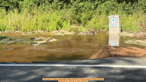 [Pipe burst, eroded underneath State Road 21 in Clay County, lanes blocked, 2026-08-12 --WCJB © Jenn Samsel]