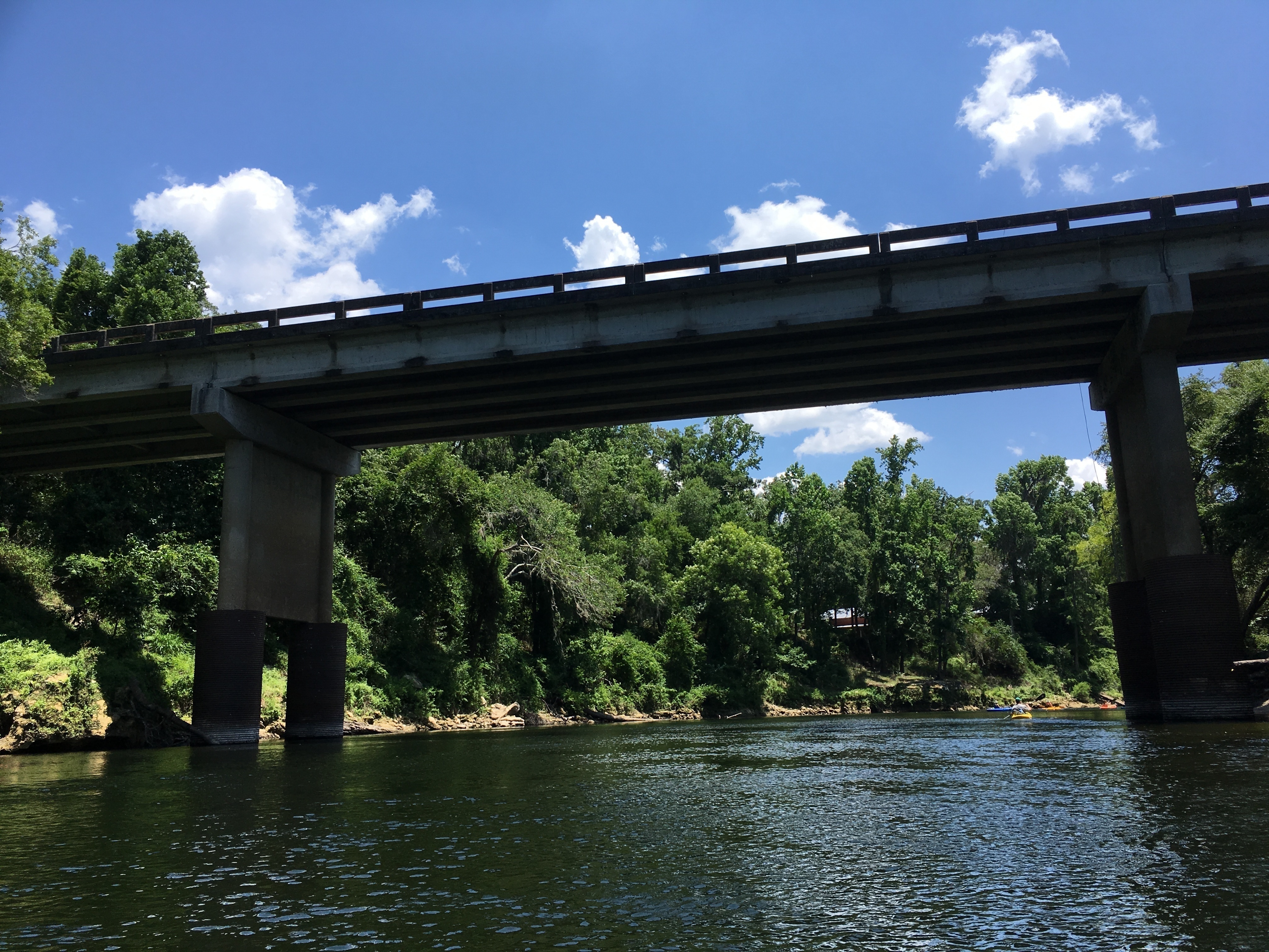 With paddlers and edifice beyond bridge, 14:11:26, 30.4104306, -83.1802750