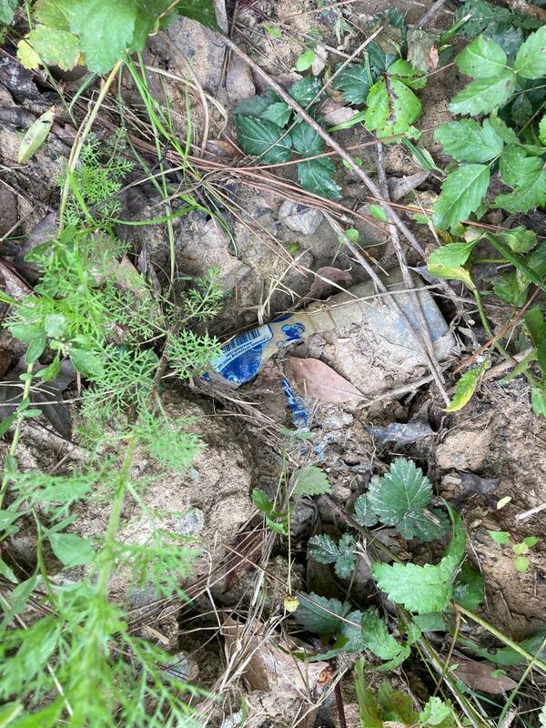 This plastic water bottle was buried under some of the road bed build up. It's been there a while.