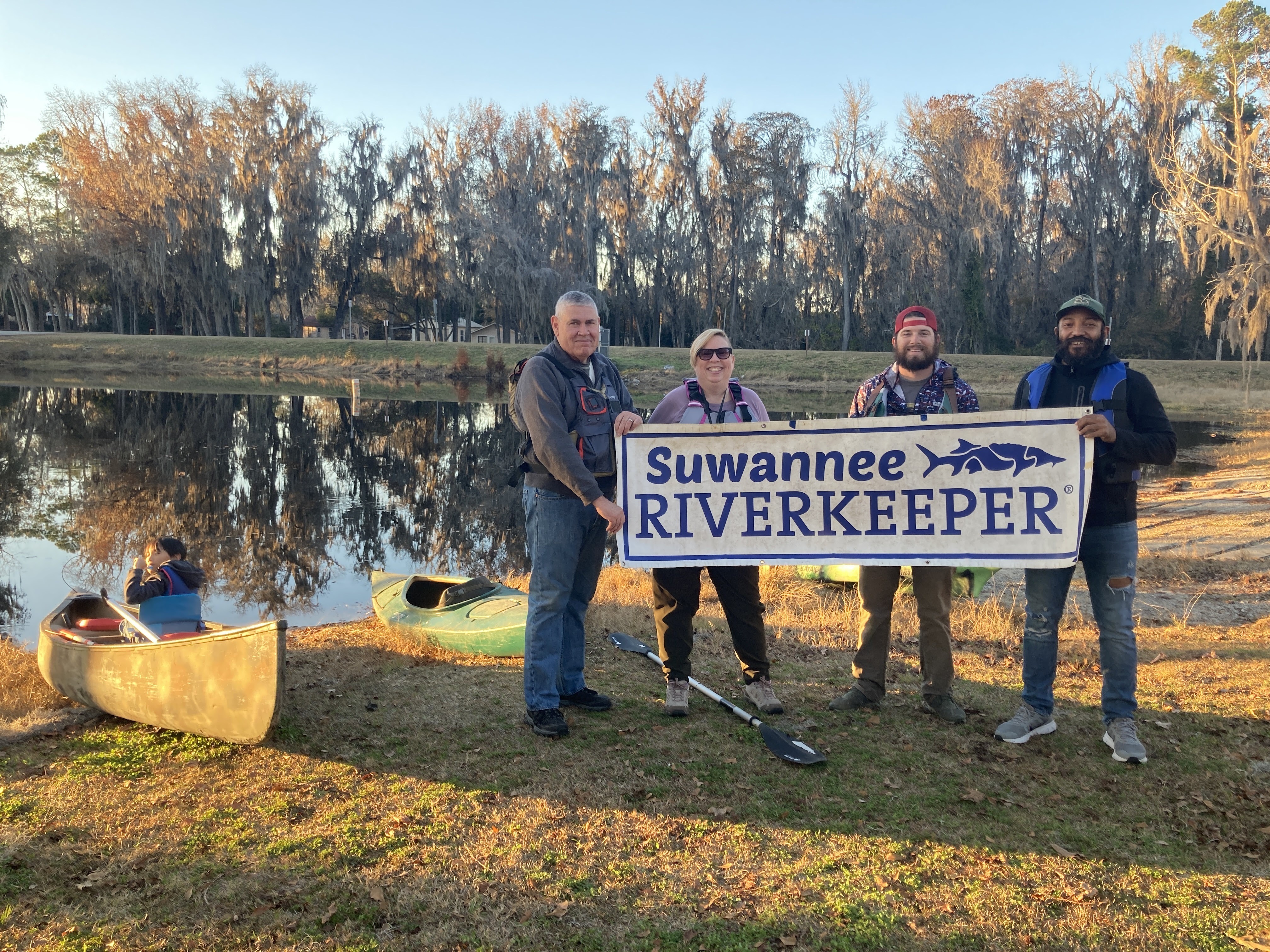 Paddlers with Suwannee Riverkeeper Banner