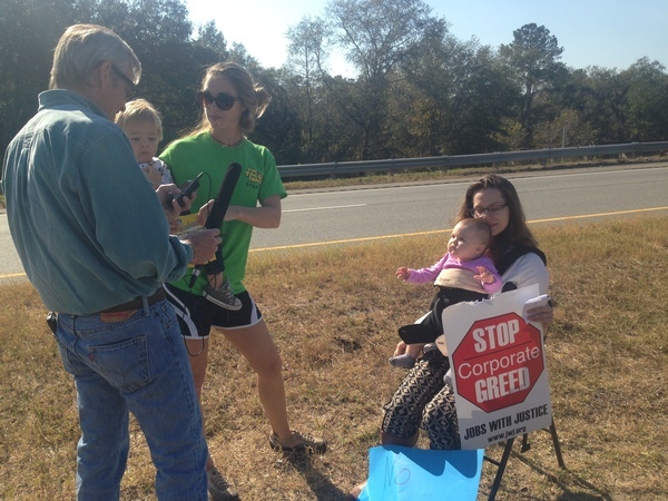 Mothers and children say to WUSF Stop Corporate Greed