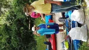 Julie Bowland with the fishing float she collected, 30.4801200, -83.2447500