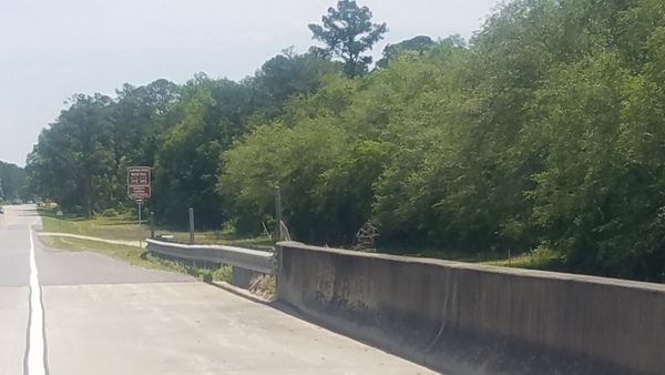 Wrong side of river, Eastbound sign