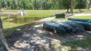 Canoes and water at bottem of ramp, Boat Ramp